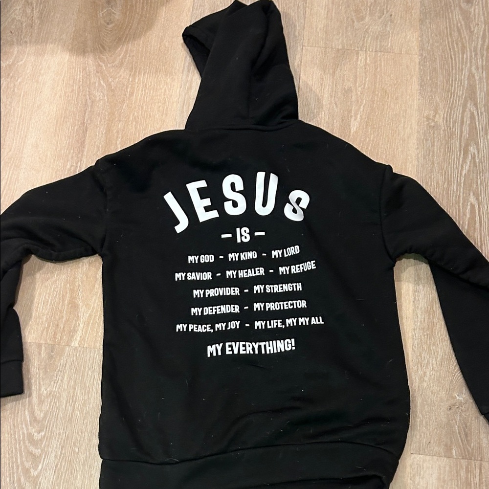 Black Hoodie with White 'Jesus Is' Print